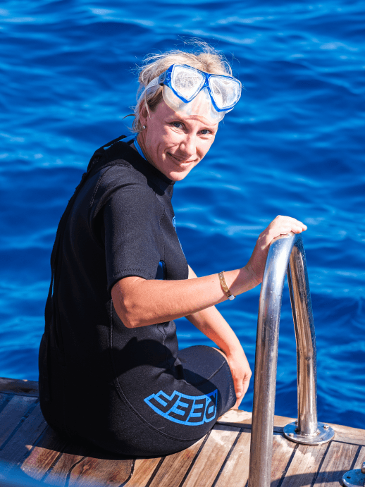 Diver on a boat wearing a mask without glasses