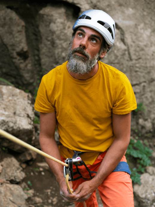 Climber looking up a rock face without glasses